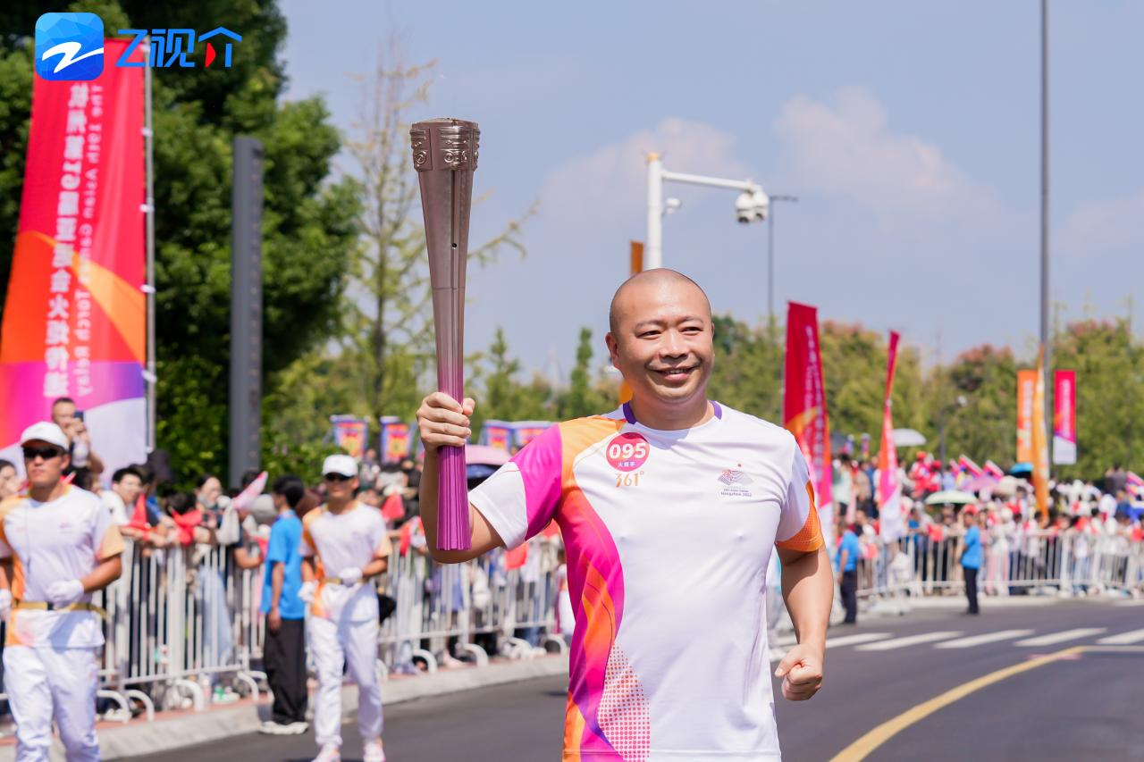 杭州亚运会火炬传递来到金华 顾家家居顾海龙担任火炬手